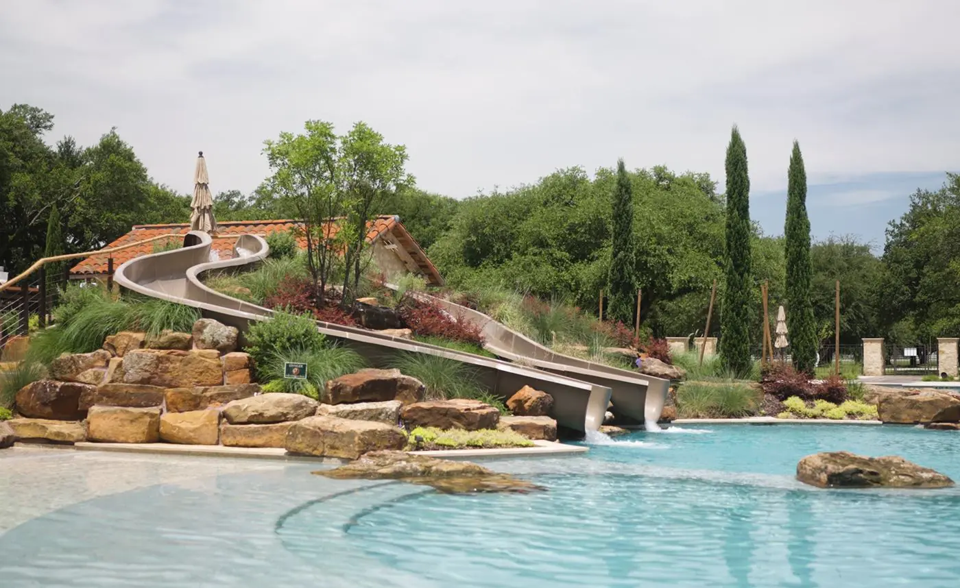 Resort-style hotel pool with sun shelf, cabanas and lounge deck