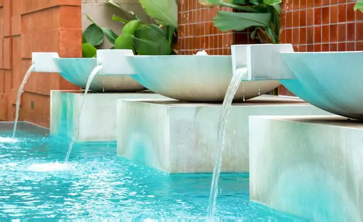Custom pool water feature by Heavenly Outdoor in Houston, Texas