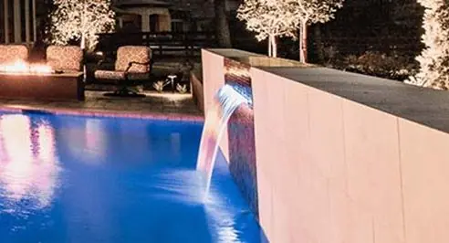 Sheer descent and scuppers spilling into a pool