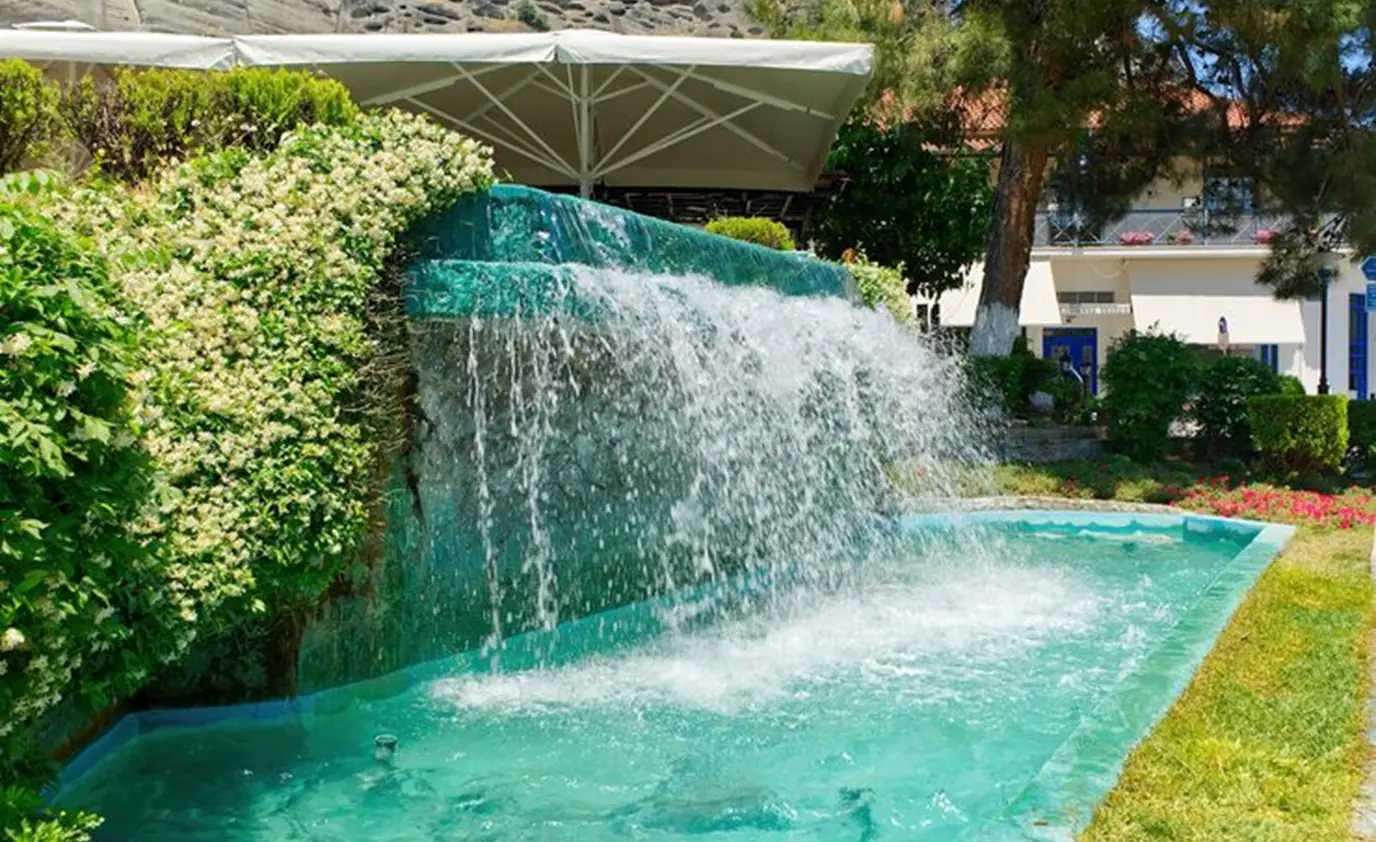 Cascading waterfall pool water feature by Heavenly Outdoor in River Oaks, TX